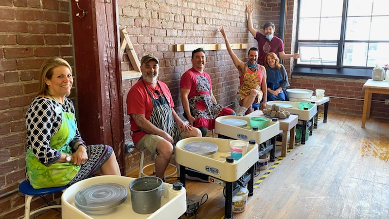 Students using pottery wheels