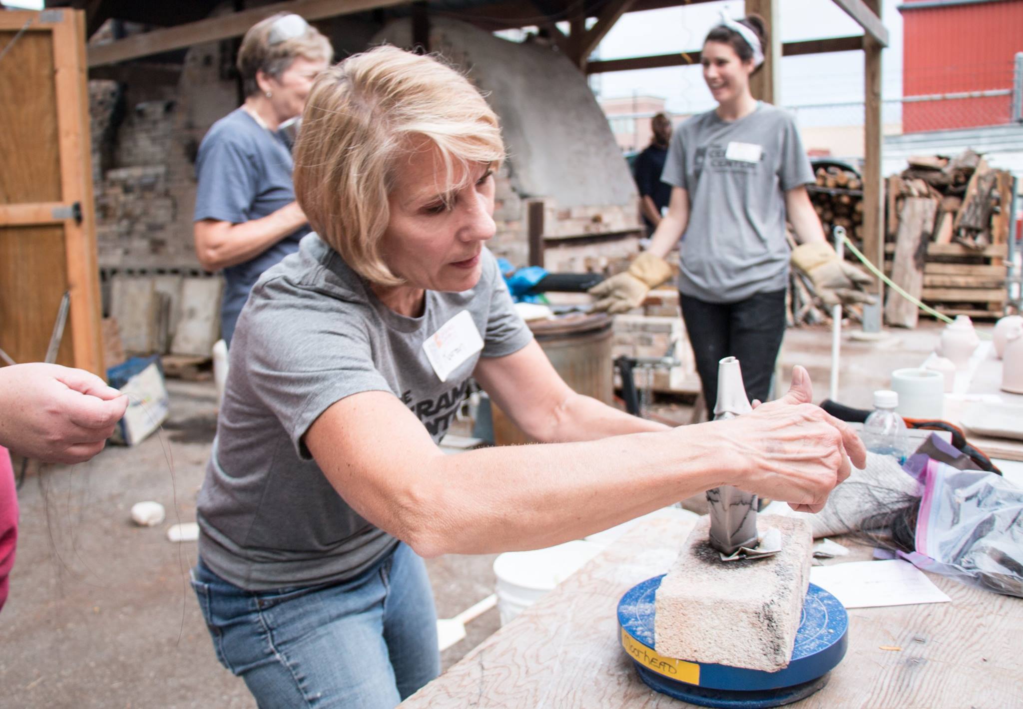 People making pottery