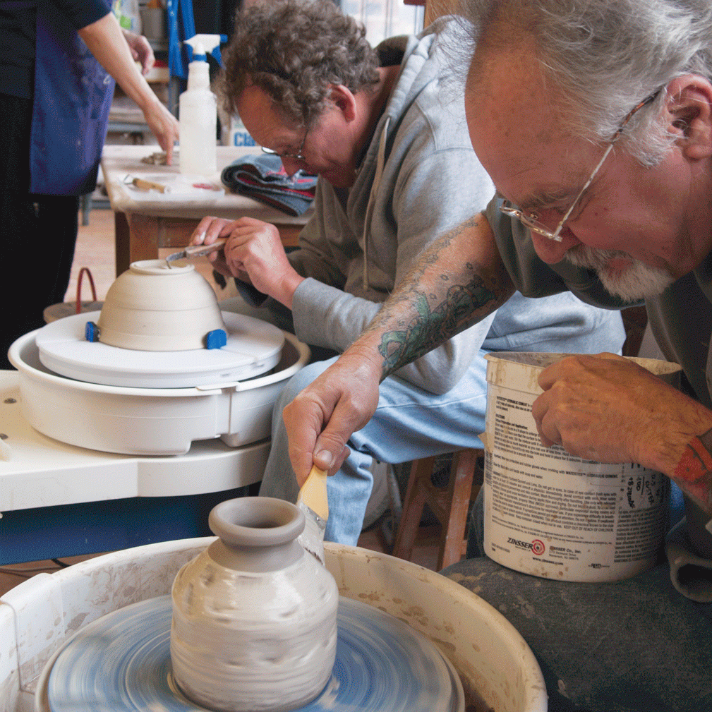 People making pottery